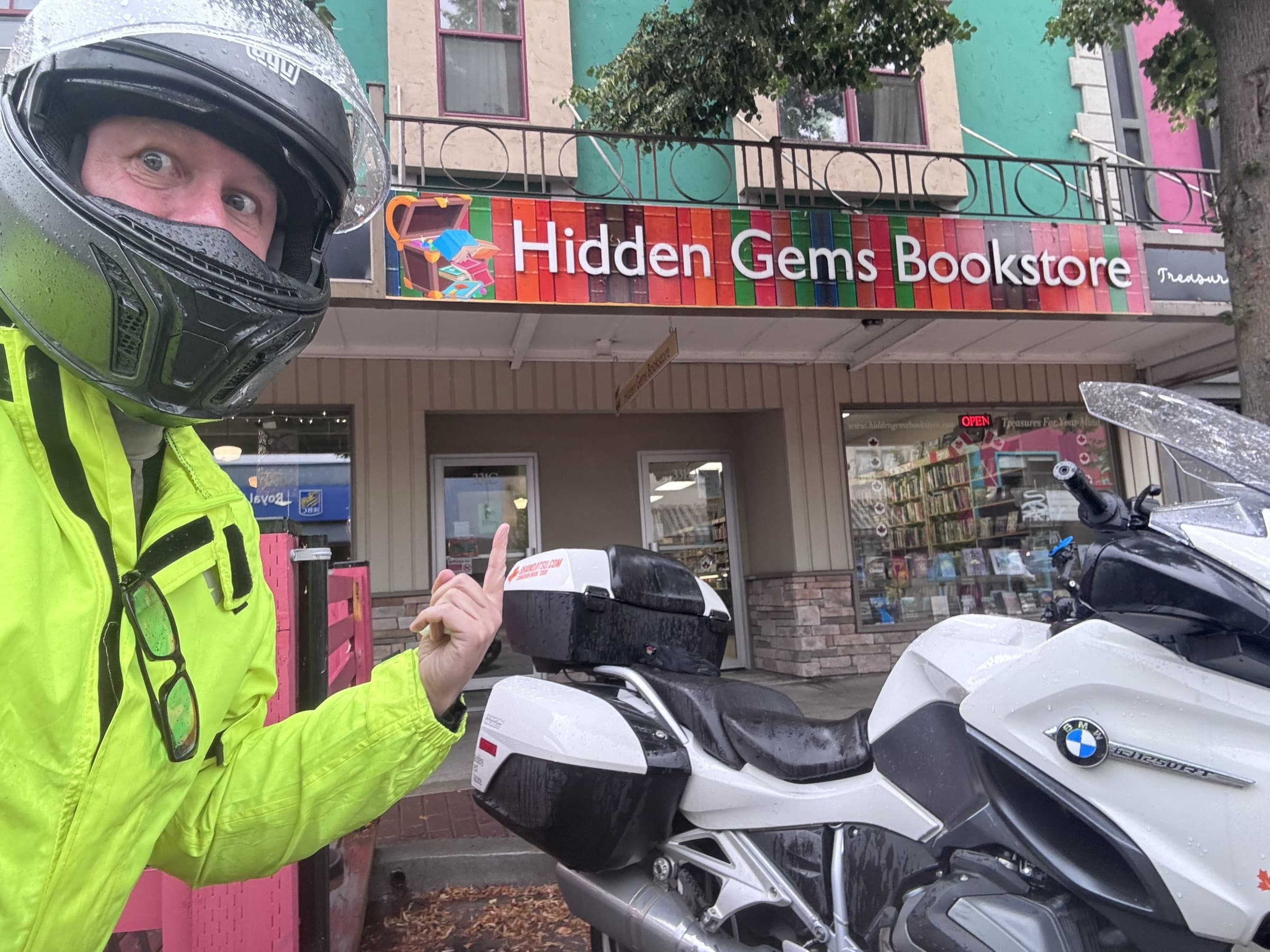 Michael Dargie outside Hidden Gems Bookstore in BC on the BrandJitsu™ Canadian Book Tour, motorcycle in foreground
