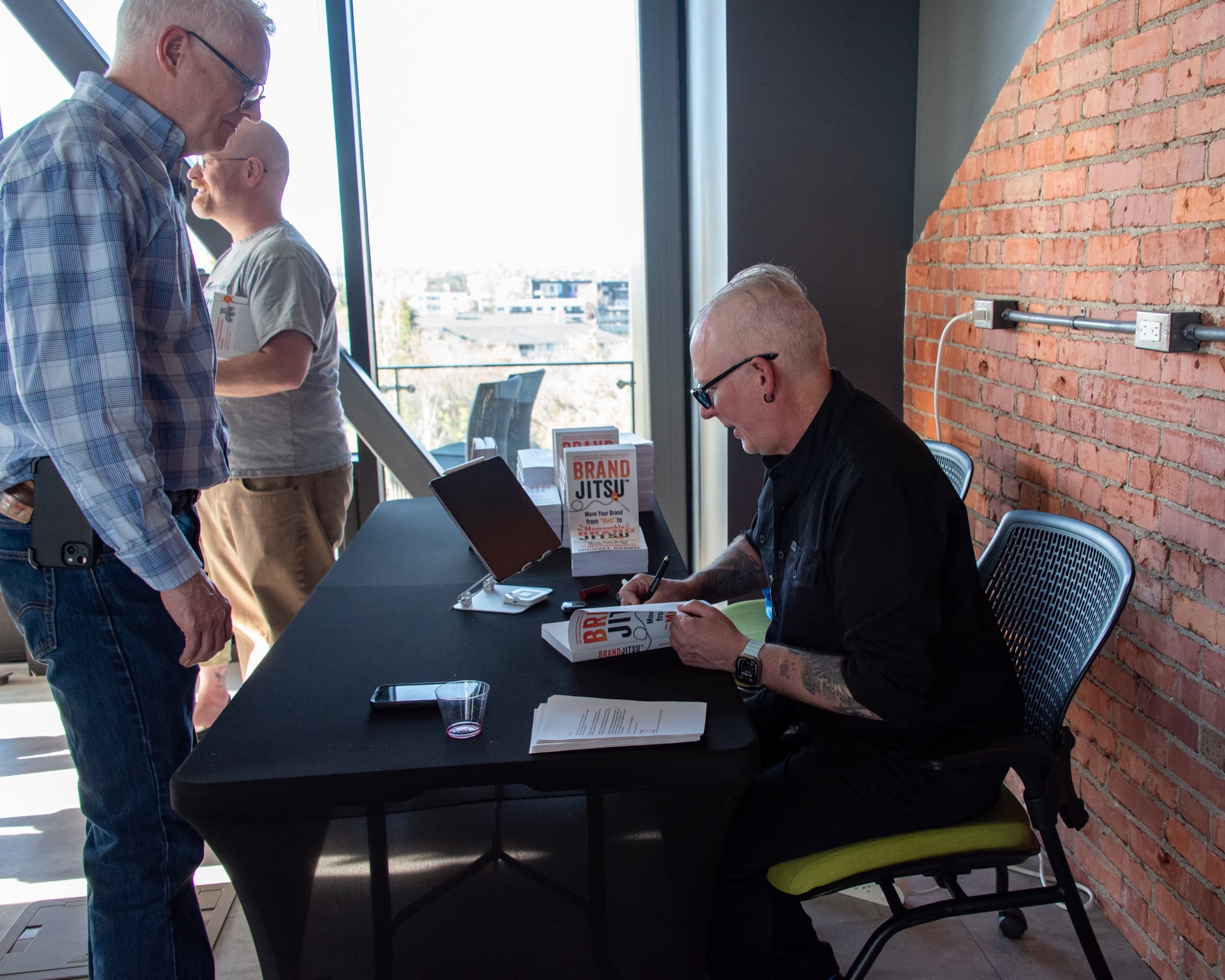 Michael Dargie signing copies of BrandJitsu™ at the book launch